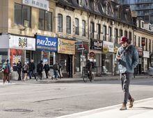 People walking past local stores on Yonge street , photographed on May 5, 2023 Ammar Bowaihl/The Globe and Mail