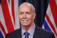 Premier John Horgan answers questions from the media in Victoria, B.C., on Tuesday, February 8, 2022. The premier says he's considering taking the same approach as a Victoria couple who placed a newspaper ad to find a family doctor in his attempt to pressure the federal government to increase health funding.THE CANADIAN PRESS/Chad Hipolito