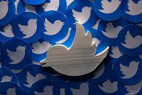 FILE PHOTO: A 3D-printed Twitter logo on non-3D printed Twitter logos is seen in this picture illustration taken April 28, 2022. REUTERS/Dado Ruvic/Illustration/File Photo