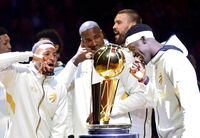 Toronto Raptors players Norman Powell, left to right, Serge Ibaka, Marc Gasol and Pascal Siakam stand with their rings behind the Larry O'Brien NBA Championship Trophy before playing the New Orleans Pelicans in Toronto on Tuesday Oct. 22, 2019. The Raptors defeated the Golden State Warriors last spring in a six-game final to win the NBA title for the first time in franchise history. THE CANADIAN PRESS/Frank Gunn