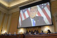 FILE - A video of former President Donald Trump is shown on a screen, as the House select committee investigating the Jan. 6 attack on the U.S. Capitol holds its final meeting on Capitol Hill in Washington, Monday, Dec. 19, 2022. (AP Photo/J. Scott Applewhite, File)