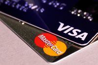 FILE PHOTO: MasterCard and VISA credit cards are seen in this picture illustration taken June 9, 2016. This logo has been updated and is no longer in use.  REUTERS/Maxim Zmeyev/Illustration