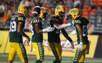 Edmonton Elks' Derel Walker (87), right, celebrates his touchdown with teammates, Kenny Lawler (89), Chris Osei-Kusi (18), and Kai Locksley (10) during second half CFL action against the Ottawa Redblacks in Ottawa on Friday, August 19, 2022. THE CANADIAN PRESS/ Patrick Doyle
