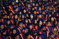 Spring 2020 graduates listen during a convocation ceremony at Simon Fraser University, in Burnaby, B.C., on Friday, May 6, 2022. Some companies are providing debt repayment support, the goal is to improve the well-being of employees dealing with the stress of student loans.THE CANADIAN PRESS/Darryl Dyck