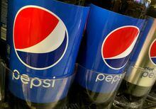 FILE PHOTO: Pepsi bottles are seen lined up at a store in New York, U.S. July 5, 2016. Picture taken July 5, 2016.   REUTERS/Shannon Stapleton