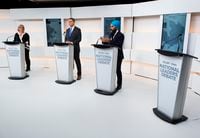 A empty podium stand where Liberal Leader Justin Trudeau turned down the invitation for the debate as Green Party Leader Elizabeth May, left, Conservative Leader Andrew Scheer, centre, and NDP Leader Jagmeet Singh take part during the Maclean's/Citytv National Leaders Debate in Toronto on Thursday, September 12, 2019. THE CANADIAN PRESS/Frank Gunn