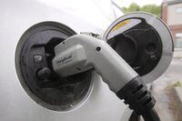 An electric vehicle is shown attached to a charging station on Tuesday, June 18, 2013 in Montpelier, Vt. THE CANADIAN PRESS/AP-Toby Talbot