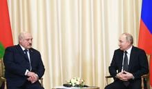 Russian President Vladimir Putin, right, and Belarusian President Alexander Lukashenko talk during their meeting at the Novo-Ogaryovo state residence, outside Moscow, Russia, Friday, Feb. 17, 2023. (Vladimir Astapkovich, Sputnik, Kremlin Pool Photo via AP)