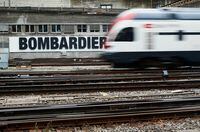 FILE PHOTO: A Bombardier advertising board is pictured in front of a SBB CFF Swiss railway train at the station in Bern, Switzerland, October 24, 2019. REUTERS/Denis Balibouse