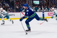 Mar 23, 2023; Vancouver, British Columbia, CAN; Vancouver Canucks forward J.T. Miller (9) scores on this shot against the San Jose Sharks in the first period at Rogers Arena. Mandatory Credit: Bob Frid-USA TODAY Sports