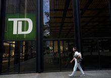 A man walks past the TD Bank in the Bay Street Financial District in Toronto on Friday, Aug. 5, 2022. TD Bank Group reported a fourth-quarter profit of $6.67 billion, up from $3.78 billion in the same quarter last year, boosted by a one-time gain related to its deal to buy U.S.-based First Horizon Bank and the sale of Schwab shares. THE CANADIAN PRESS/Nathan Denette