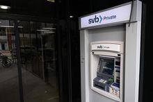 In this file photo taken on March 20, 2023, The SVB Private logo is displayed on an ATM outside of a Silicon Valley Bank branch in Santa Monica, California.
