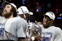 ATLANTA, GEORGIA - FEBRUARY 03: James White #28 of the New England Patriots celebrates with the Vince Lombardi Trophy after their teams 13-3 win over the Los Angeles Rams during Super Bowl LIII at Mercedes-Benz Stadium on February 03, 2019 in Atlanta, Georgia. (Photo by Al Bello/Getty Images)