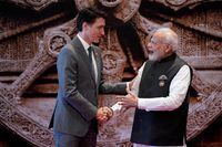 FILE PHOTO: Indian Prime Minister Narendra Modi welcomes Canada Prime Minister Justin Trudeau upon his arrival at Bharat Mandapam convention center for the G20 Summit, in New Delhi, India, Saturday, Sept. 9, 2023. Evan Vucci/Pool via REUTERS/File Photo