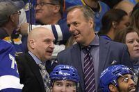 FILE -Tampa Bay Lightning coach Jon Cooper, right, and assistant coach Derek Lalonde talk during the third period of the team's NHL hockey game against the St. Louis Blues on Dec. 2, 2021, in Tampa, Fla. The Detroit Red Wings have hired Lalonde as their new coach after a lengthy search process. (AP Photo/Chris O'Meara, File)