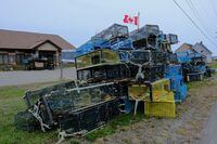 Lobster traps belonging to fishermen of the Sipekne'katik band, which were seized in protest by non-native fishers, lie dumped outside the federal Department of Fisheries and Oceans (DFO) office in Meteghan, Nova Scotia, Canada September 22, 2020. The Sipekne'katik band, part of the First Nations Mi'kmaw community, began harvesting lobster outside of the commercial season due to a 1999 Supreme Court of Canada ruling. REUTERS/Ted Pritchard