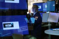 Traders work on the floor of the New York Stock Exchange (NYSE) on Oct. 27.