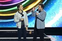 Marc Kielburger, left, and Craig Kielburger speak at WE Day California at The Forum on Thursday, April 25, 2019, in Inglewood, Calif. (Photo by Chris Pizzello/Invision/AP)