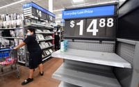 In this file photo taken on Nov. 22, 2021, people shop at a Walmart in Rosemead, California.