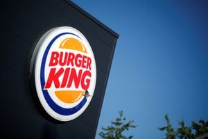 FILE PHOTO: The Burger King company logo stands on a sign outside a restaurant in Bretigny-sur-Orge, near Paris, France, July 30, 2020. REUTERS/Benoit Tessier/File Photo