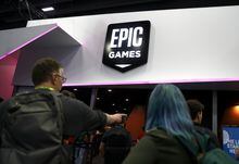 SAN FRANCISCO, CALIFORNIA - MARCH 20: Attendees walk by the Epic Games booth at the 2019 GDC Game Developers Conference on March 20, 2019 in San Francisco, California. The GDC runs through March 22. (Photo by Justin Sullivan/Getty Images)
