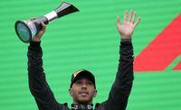 Second placed Mercedes driver Lewis Hamilton of Britain celebrates on the podium after the Hungarian Formula One Grand Prix at the Hungaroring racetrack in Mogyorod, near Budapest, Hungary, Sunday, July 31, 2022. (AP Photo/Darko Bandic)