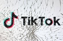 TikTok logo is seen through broken glass in this illustration taken, January 25, 2023. REUTERS/Dado Ruvic/Illustration