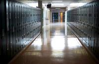 A empty hallway is seen at McGee Secondary school in Vancouver,on Sept. 5, 2014. The union representing Ontario's high school teachers will be releasing the results of their strike votes today. A media advisory also says the president of the Ontario Secondary School Teachers' Federation will be talking about the union's "next steps." THE CANADIAN PRESS/Jonathan Hayward