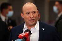 Israeli Prime Minister Naftali Bennett speaks to reporters following a session at the Knesset (Israeli parliament), in Jerusalem on November 4, 2021. - Israeli lawmakers passed the country's first state budget in three years, in a victory for the disparate governing coalition, ahead of a key vote on a 2022 spending package. (Photo by Ahmad GHARABLI / AFP) (Photo by AHMAD GHARABLI/AFP via Getty Images)