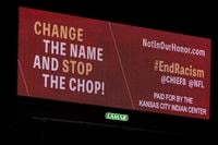A billboard calling for a name change and an end to the Kansas City Chiefs "chop" stands along Interstate 70 in Kansas City, Mo., Wednesday, Feb. 3, 2021. Pressure is mounting for the Super Bowl-bound Chiefs to abandon a popular tradition in which fans break into a war chant while making a chopping hand motion designed to mimic the Native American tomahawk. (AP Photo/Orlin Wagner)