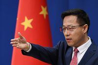 Chinese Foreign Ministry spokesman Zhao Lijian takes a question during a media briefing in Beijing, on April 8, 2020.