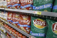 Lay's products, a PepsiCo brand, are displayed at a Wal-Mart Neighborhood Market Thursday, June 4, 2015 in Bentonville, Ark.; Loblaw Companies Ltd. says chip brands like Cheetos, Doritos and Ruffles will be back on store shelves by Easter weekend after resolving a pricing dispute with Frito-Lay Canada. (AP Photo/Danny Johnston)