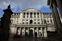 People walk past the Bank of England, in London, Britain October 31, 2021. REUTERS/Tom Nicholson