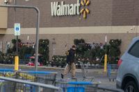 CHESAPEAKE, VA - NOVEMBER 24: Members of the FBI investigate Tuesdays fatal shooting at the Chesapeake Walmart Supercenter on November 24, 2022 in Chesapeake, Virginia. Six people, including the suspected gunman, are dead following the Tuesday night shooting. (Photo by Nathan Howard/Getty Images)