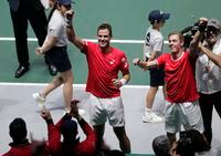 Canada's Denis Shapovalov, right, and his partner Vasek Pospisil celebrate after winning their Davis Cup semifinal doubles match against Russia's Karen Khachanov and Andrey Rublev, in Madrid, Spain, Saturday, Nov. 23, 2019. (AP Photo/Bernat Armangue)