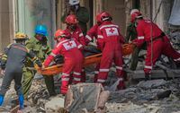 Rescuers recover a body at the site of Friday's deadly explosion that destroyed the five-star Hotel Saratoga, in Havana, Cuba, Saturday, May 7, 2022. (AP Photo/Ramon Espinosa)