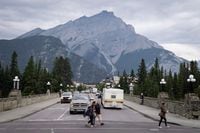 Smoke haze from forest fires burning in Alberta and British Columbia hangs over Banff, Alta., in Banff National Park, Friday, July 21, 2017. A fire ban is now in place in three mountain parks in Alberta and British Columbia due to a high risk of wildfires in the area. A notice posted on the Banff National Park website says the ban, which also includes Yoho and Kootenay national parks in B.C., was issued to ensure the safety of residents and visitors. THE CANADIAN PRESS/Jeff McIntosh