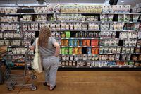 FILE PHOTO: A person shops in a supermarket as inflation affected consumer prices in Manhattan, New York City, U.S., June 10, 2022. REUTERS/Andrew Kelly/File Photo
