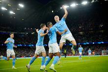 Manchester City's Erling Haaland, right, and his teammates celebrate their third goal during the Champions League semifinal second leg soccer match between Manchester City and Real Madrid at Etihad stadium in Manchester, England, Wednesday, May 17, 2023. (AP Photo/Jon Super)