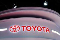 FILE PHOTO: The Toyota logo is seen at a booth during a media day for the Auto Shanghai show in Shanghai, China, April 19, 2021. REUTERS/Aly Song/File Photo