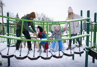 Leon and Agnieszka Gorczyca at a park with their children Nel and Maciej, who are struggling to find a place that suits both their needs and budget in Calgary, Alberta, February 20, 2023. Todd Korol/The Globe and Mail
