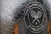 (FILES) In this file photo a water feature with the Wimbledon logo stands by the members area at the All England Tennis Club in Wimbledon, southwest London, on July 1, 2018, on the eve of the 2018 Wimbledon Championships tennis tournament. - Roger Federer and Serena Williams were among the tennis stars left devastated on Wednesday as Wimbledon was cancelled for the first time since World War II due to the coronavirus.
The cancellation of the oldest Grand Slam tournament at London's All England Club leaves the season in disarray, with no tennis set to be played until mid-July. (Photo by Ben STANSALL / AFP) / RESTRICTED TO EDITORIAL USE (Photo by BEN STANSALL/AFP via Getty Images)