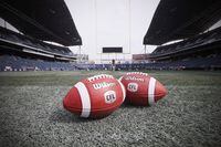 A league source said Monday that Ottawa and the provinces are both looking for additional certainty from the CFL as they consider its latest financial ask. New CFL balls are photographed at the Winnipeg Blue Bombers stadium in Winnipeg Thursday, May 24, 2018. THE CANADIAN PRESS/John Woods