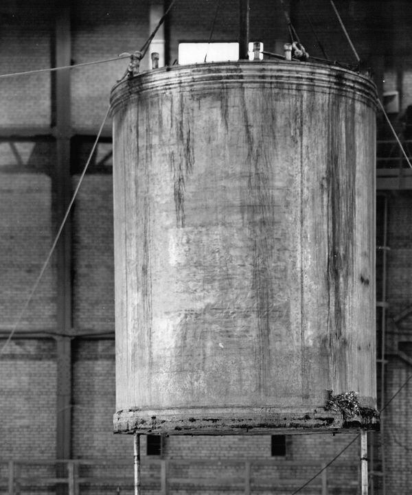 Chalk River NRX-Reactor leak, 1953 -- calandria removed from reactor being lowered into calandria bag. Photograph shows south-east sid