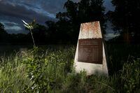 A monument marked with the names of 11 children who died while attending the Brandon Indian Residential School is seen at one of three sites where researchers, partnered with the Sioux Valley Dakota Nation, located 104 potential graves in Brandon, Manitoba, Canada, June 12, 2021. REUTERS/Shannon VanRaes