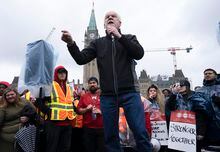 Public Service Alliance of Canada (PSAC) National President Chris Aylward speaks to striking members protesting on Parliament Hill, in Ottawa, Wednesday, April 26, 2023. THE CANADIAN PRESS/Adrian Wyld