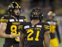 Hamilton Tiger Cats Simoni Lawrence celebrates his sack against the Saskatchewan Roughriders during second half CFL football game action in Hamilton, Ont. on Thursday, June 13, 2019. The CFL Players' Association informed the CFL on Wednesday night it's grieving the two-game suspension handed down by the league to Hamilton Tiger-Cats linebacker Simoni Lawrence. THE CANADIAN PRESS/Peter Power
