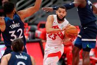 Toronto Raptors' Fred VanVleet drives against Minnesota Timberwolves' Karl-Anthony Towns during the first half of an NBA basketball game Sunday, Feb. 14, 2021, in Tampa, Fla.