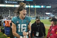 Jacksonville Jaguars quarterback Trevor Lawrence (16) celebrates after defeating the Tennessee Titans in an NFL football game, Saturday, Jan. 7, 2023, in Jacksonville, Fla. The Jaguars won 20-16. (AP Photo/John Raoux)