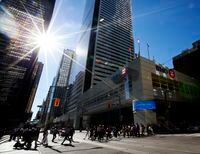 People pass by the Bank of Montreal in Toronto on Tuesday, August 28, 2012 as the big six Canadian banks start reporting third quarter earnings beginning Tuesday with Scotiabank and Bank of Montreal followed by TD, Royal Bank, CIBC and National Bank Thursday. THE CANADIAN PRESS/Michelle Siu